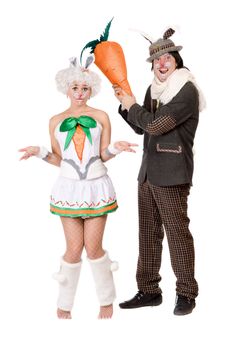 Funny couple with carrot dressed as rabbits