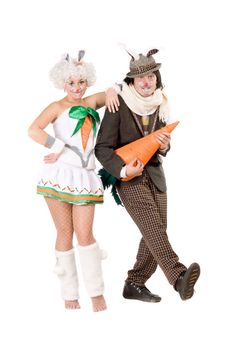 Funny couple with carrot dressed as rabbits. Isolated on white