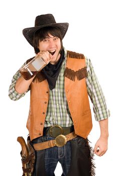 Portrait of young cowboy with a bottle of whiskey