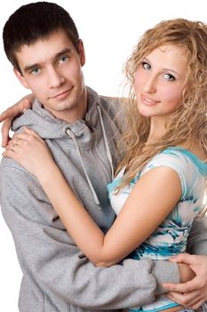 Portrait of young attractive hugging couple. Isolated on white