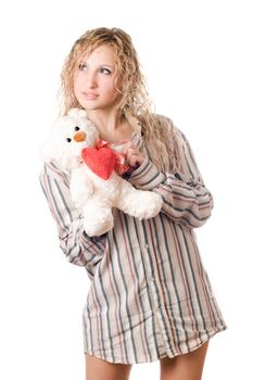 Thoughtful blonde holding teddy bear. Isolated on white