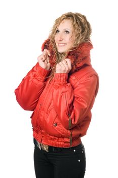 Pretty young smiling blonde in red jacket with hood. Isolated on white