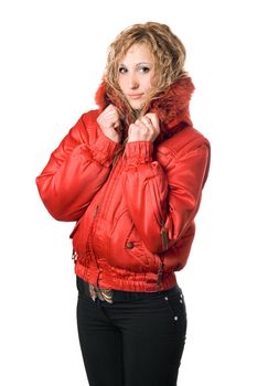Pretty young blonde in red jacket with hood. Isolated on white