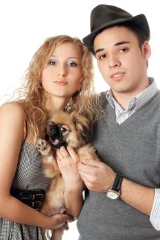 Portrait of young couple with a dog