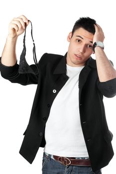 Young man with women's panties in his hands