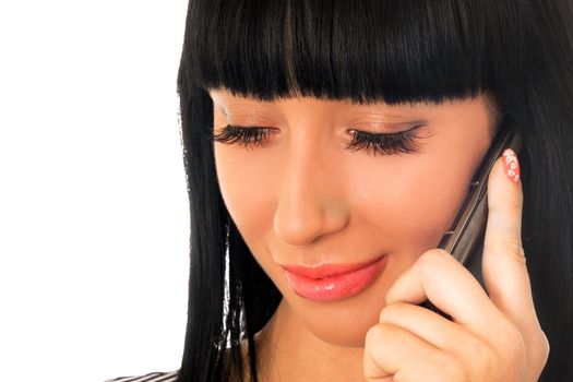 Portrait of the pretty girl speaking on the phone