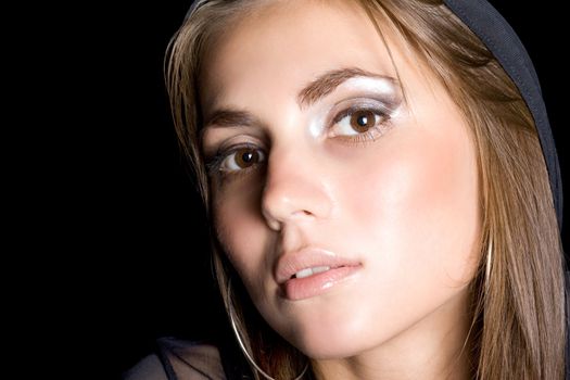 portrait of the pretty young woman. Isolated on black
