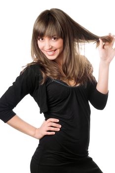 Cheerful brunette in black dress posing. Isolated on white