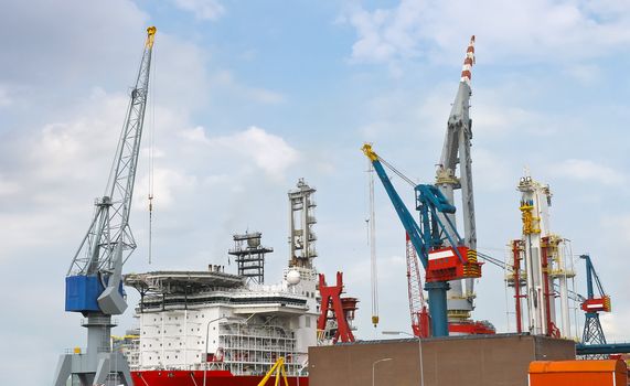 Industrial landscape. Ship and crane in shipyard