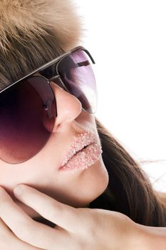 Portrait of lady wearing sunglasses with sugar lips. Isolated