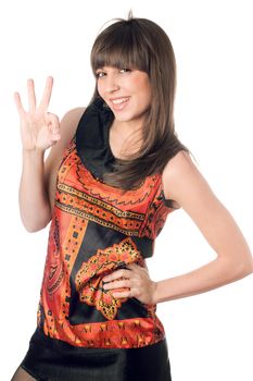 Cheerful young caucasian woman showing ok. Isolated on white