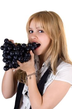 Portrait of the girl eating grapes. Isolated