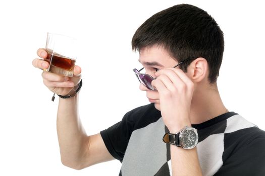 Young man with a glass of whiskey