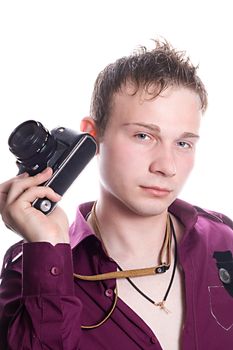 The young man with old camera. Isolated on white