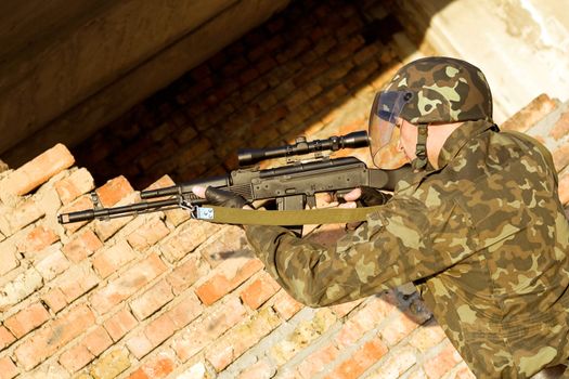 Soldier assaulting near the red brick wall