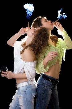 Two girlfriends with a glass of brandy and cigars