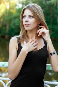 Portrait of beautiful young blonde in a park