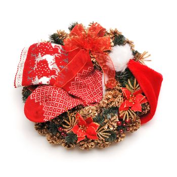 Traditional christmas wreath with santa hat an stocking isolated on white