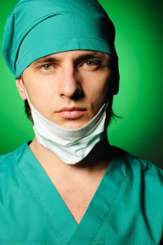 Surgeon with mask over green