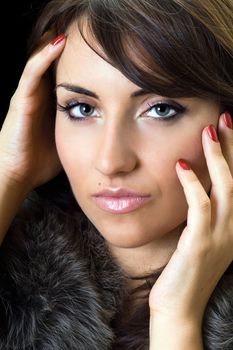 Portrait of young fascinating woman. Isolated on black
