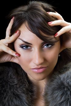 Portrait of sexy brunette. Isolated on black