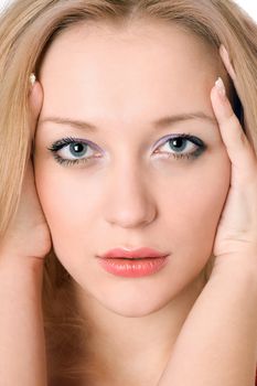 Portrait of young pretty blond woman. Isolated on white