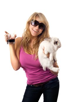 Playful young blonde with a glass of drink and little rabbit