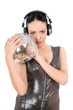 Young woman in headphones with a mirror ball. Isolated on white