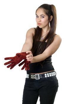 Young pretty woman pulling on gloves. Isolated