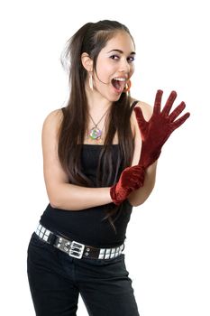 Young playful woman pulling on gloves. Isolated on white