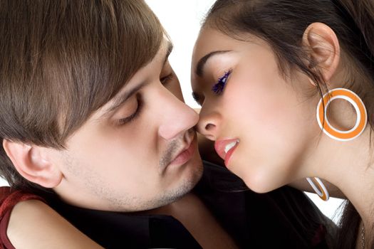 Portrait of passionate kissing couple. Isolated on white