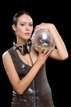 Portrait of brunette with a mirror ball in her hands. Isolated on black