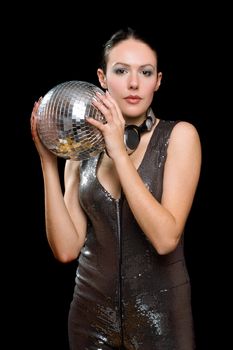 Portrait of nice young woman with a mirror ball in her hands. Isolated on black