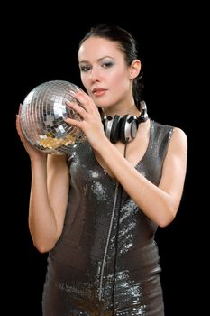 Portrait of young woman with a mirror ball in her hands. Isolated on black
