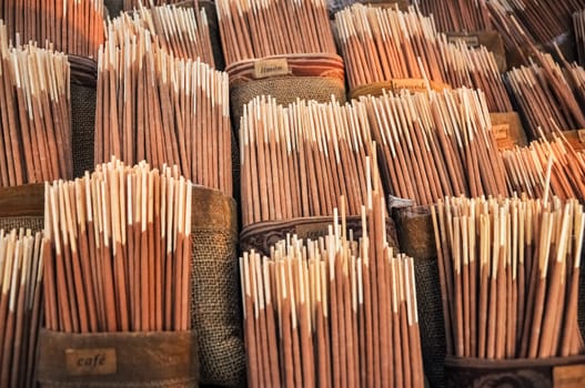 Various flavors of incense for sale.