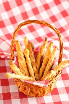 Cheese twists pastry over red cloth