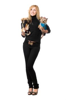 Cheerful young blonde posing with two dogs. Isolated