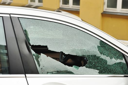 Broken passenger window, car theft