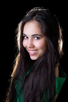 Portrait of the smiling girl in a green jacket
