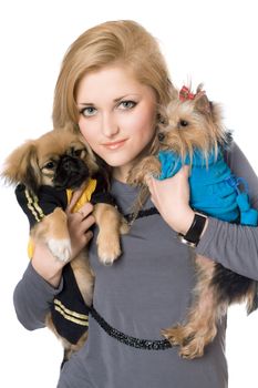 Portrait of pretty blonde with two dogs. Isolated on white