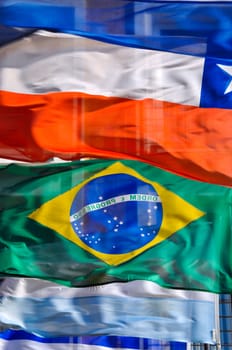 A row of waving South American flags.