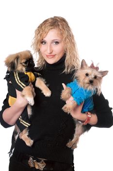 Portrait of smiling pretty blonde with two dogs. Isolated on white