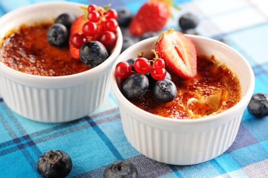 Creme brulee (cream brulee, burnt cream) with fruits and berries