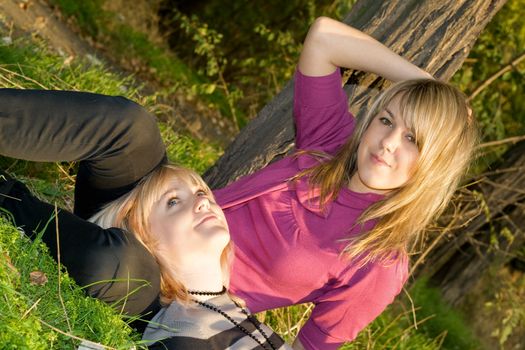 Two happy beauty young blonde outdoors