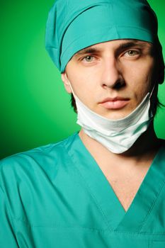 Surgeon with mask over green