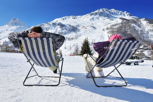 Couple at mountains in winter, Val-d'Isere, Alps, France