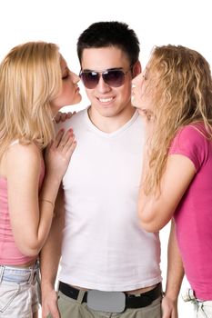 Two pretty blonde kissing handsome young man