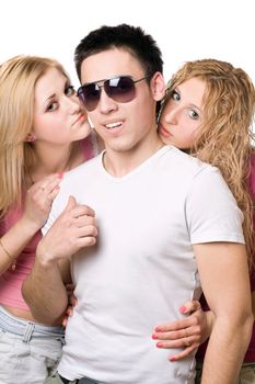 Portrait of a two attractive blonde women with handsome young man