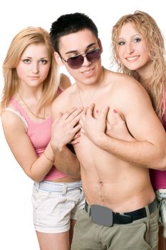 Two playful blonde women with handsome young man