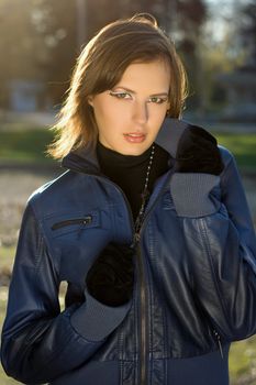 CLoseup portrait of a girl in autumn park